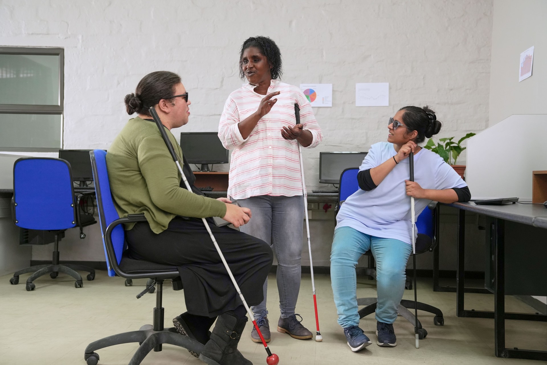 Visually impaired women in office